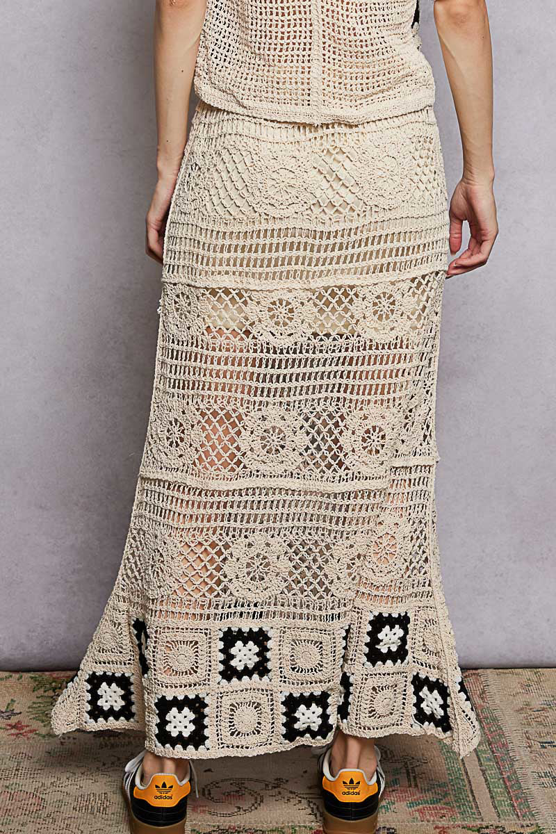 Natural black floral crochet maxi skirt with ruffled waistband and granny square weave, designed by Trendsi.
