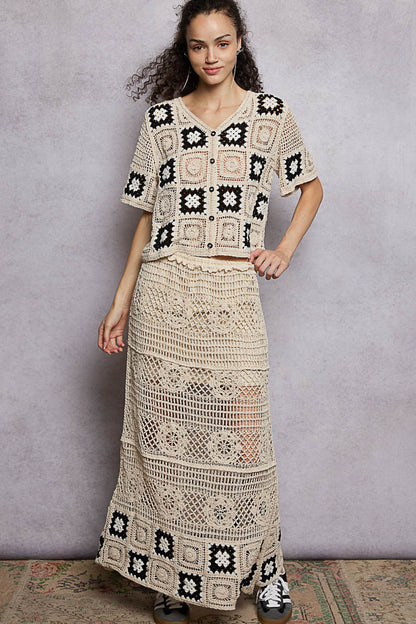 Natural black floral crochet maxi skirt with ruffled waistband and granny square weave, by Trendsi.