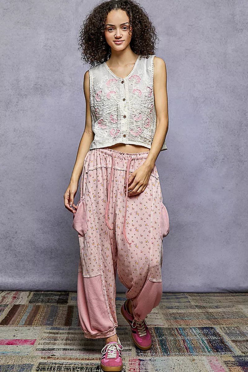 Natural pink floral embroidered V-neck vest by Trendsi featuring intricate embroidery and a relaxed, one-size-fit design.