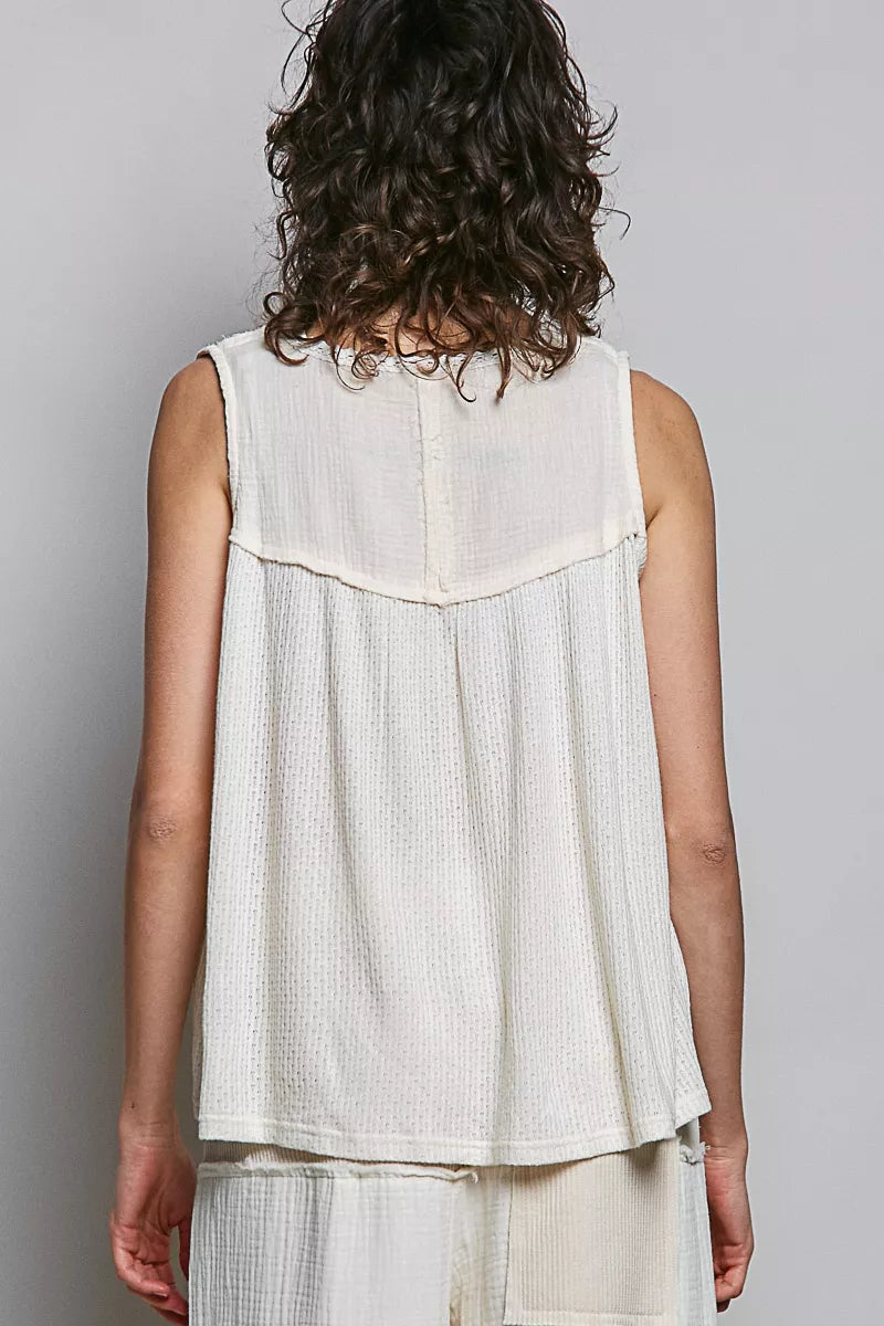 Natural floral sleeveless top by Trendsi with lace details and double gauze patch fabric, perfect for casual wear.