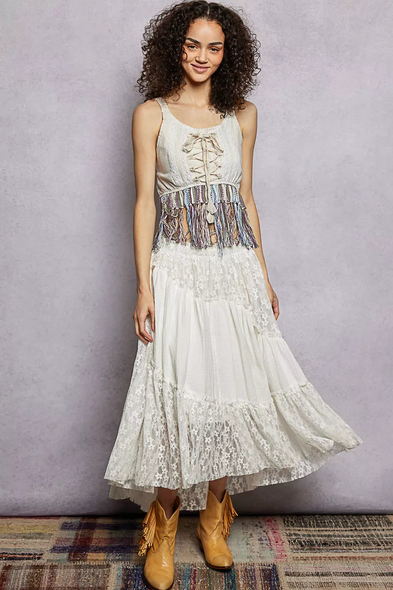 Natural-colored POL lace-up fringe hem tank top with lace detail, showcasing its stylish design and lightweight fabric.