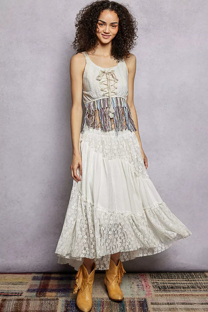 Natural-colored POL lace-up fringe hem tank top with lace detail, showcasing its stylish design and lightweight fabric.