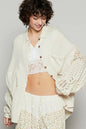 Natural white POL openwork lantern sleeve button-down gauze shirt by Trendsi, featuring lightweight breathable fabric and intricate sleeve details.