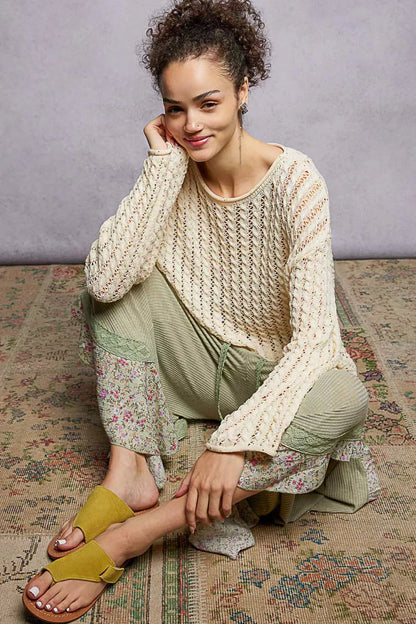 Trendsi openwork round neck knit top with shiny detail, natural fit, showcasing intricate knit pattern and subtle shimmer.