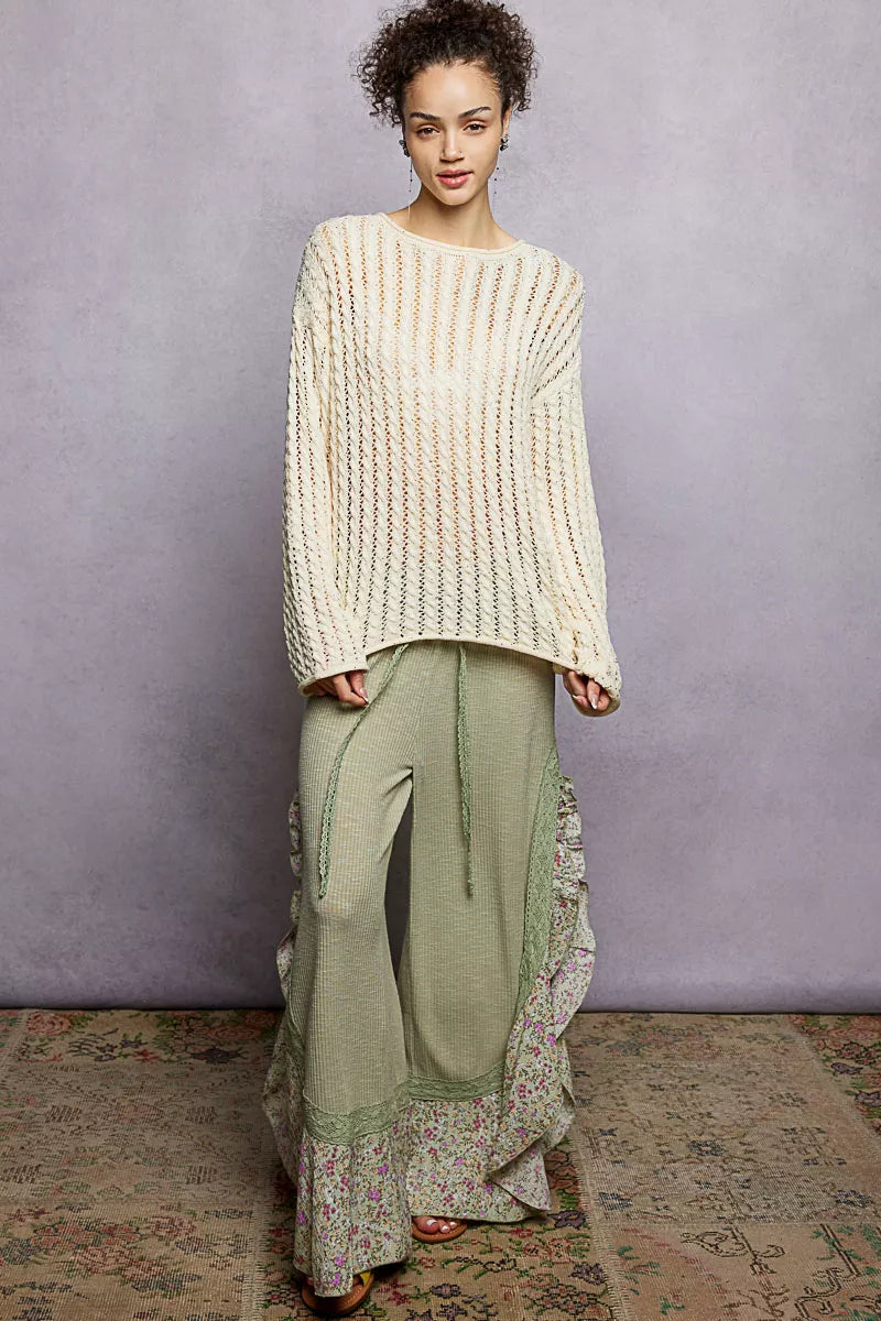 Trendsi POL openwork round neck knit top with shiny detail, featuring a lightweight, stylish design and intricate knit pattern.