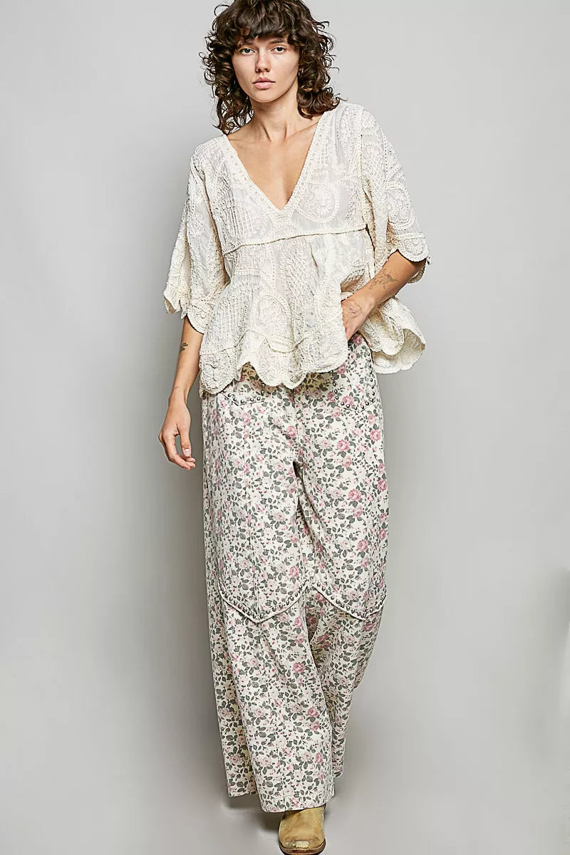 Natural V-neck crochet blouse with scalloped hem by Trendsi, featuring intricate crochet pattern and delicate scalloped detailing.