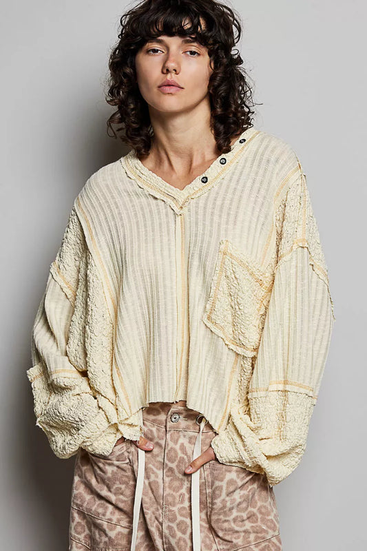 Natural V-neck long sleeve top with stitch detail from Trendsi, featuring a comfortable fit and stylish design.