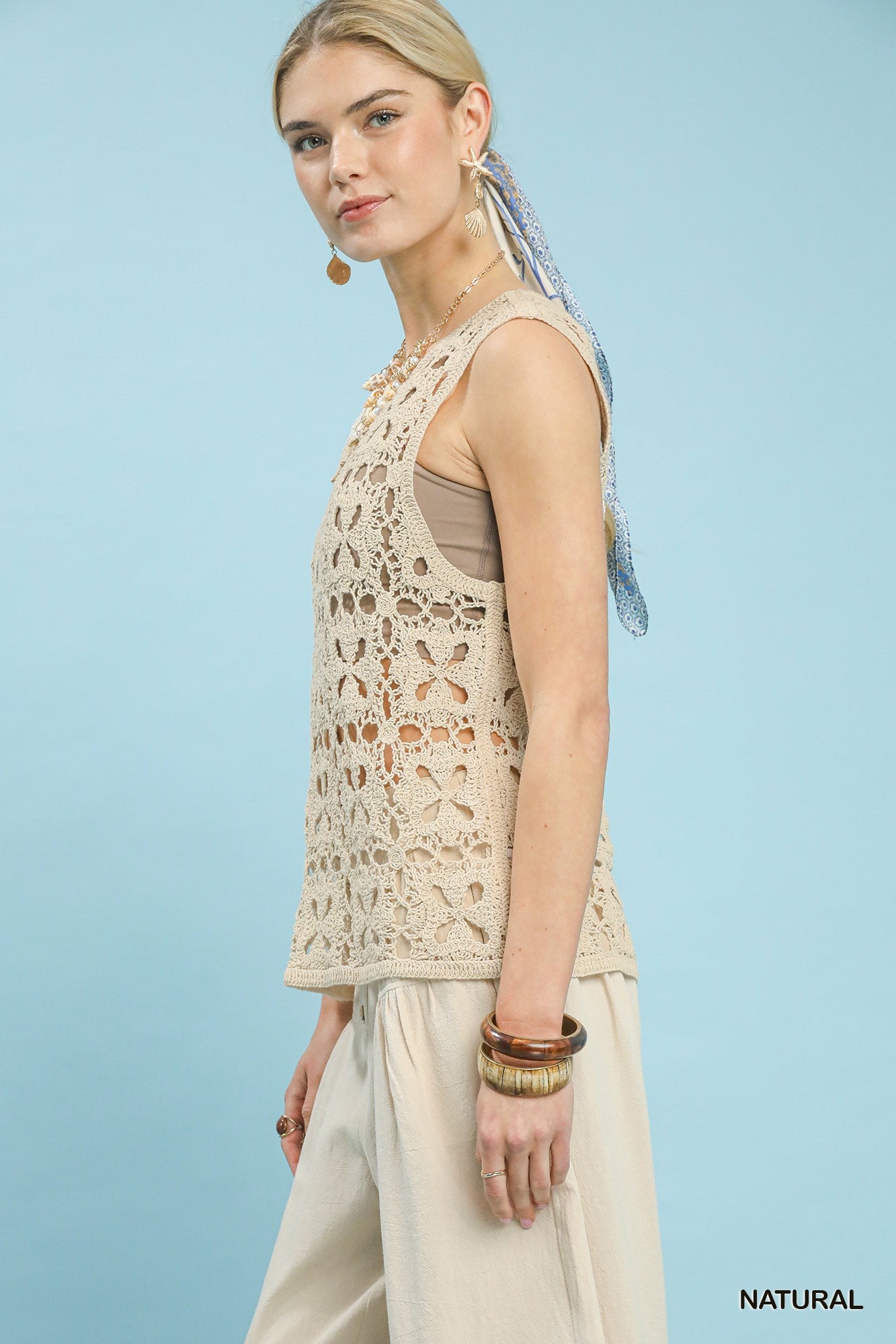 Natural beige sleeveless tank top with crochet flower motifs from Umgee, featuring a relaxed fit and casual style.