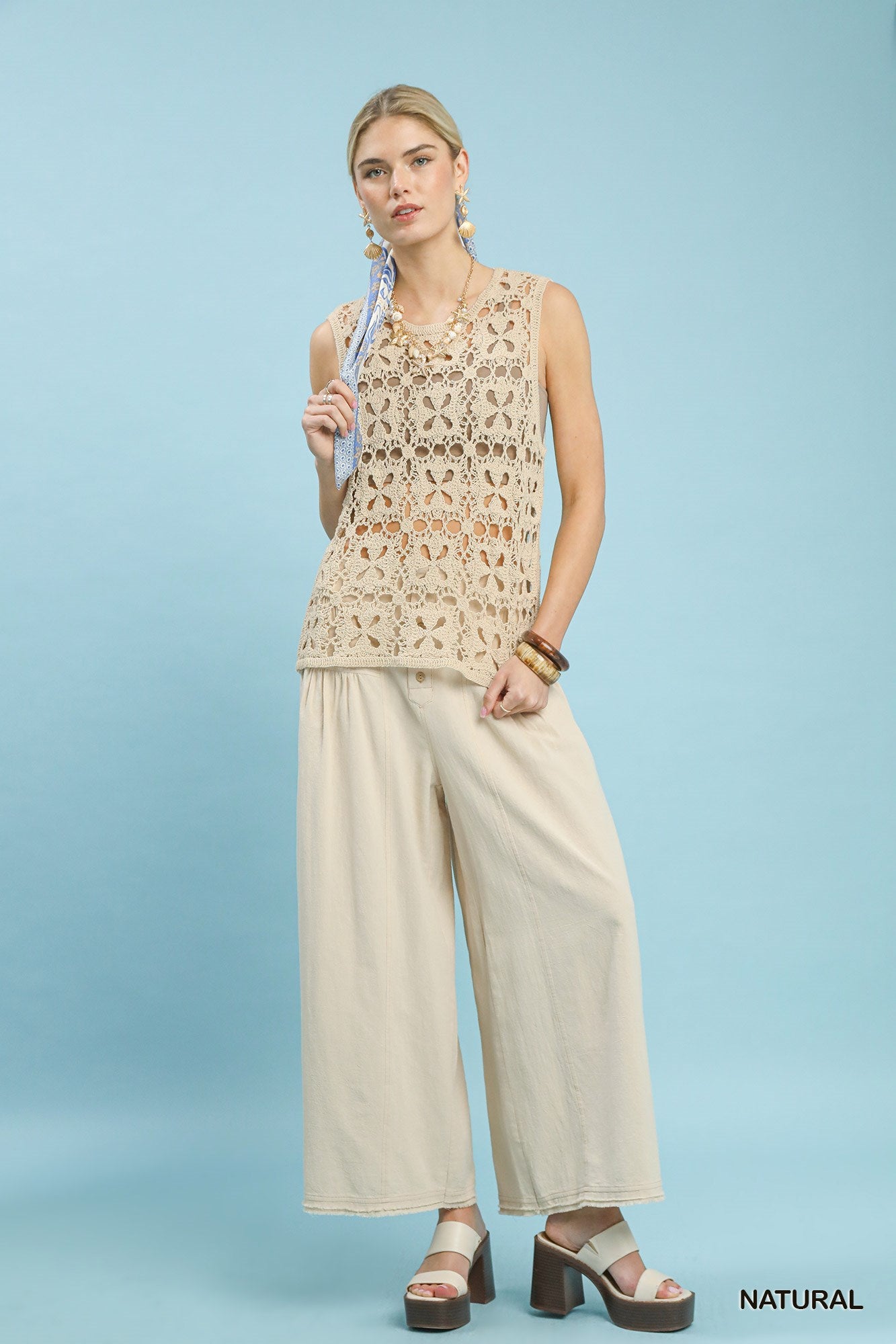 Natural beige Umgee crochet flower motif sleeveless tank top with intricate floral crochet details and a relaxed fit.