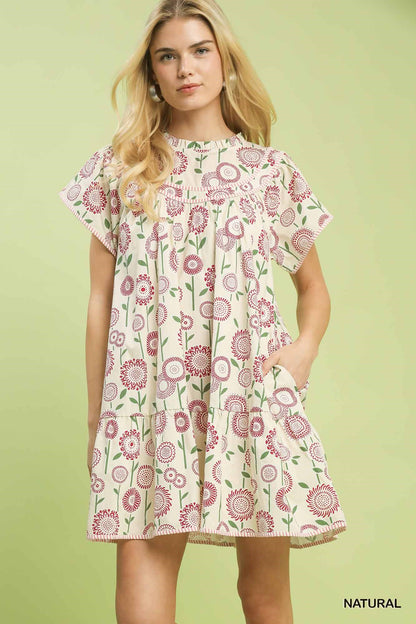 Natural beige Umgee floral print tiered babydoll dress with ruffled neckline and flowy silhouette, perfect for casual and summer wear.