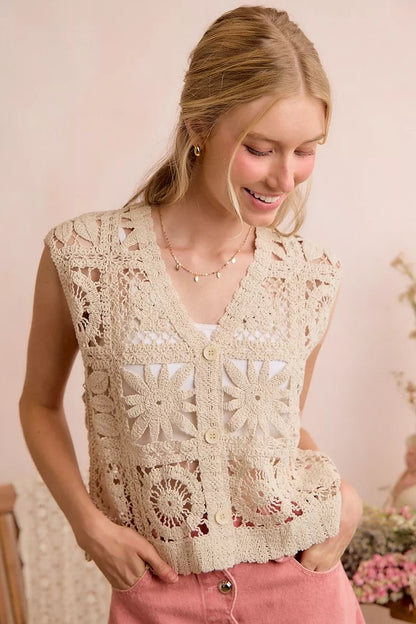 Natural-colored crochet patterned sleeveless vest top by Trendsi, showing intricate knit details and a relaxed summer style.
