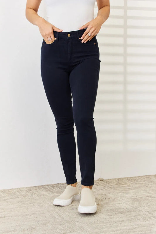 Navy Judy Blue full-size garment dyed tummy control skinny jeans displayed on a model, showing fit and fabric texture.