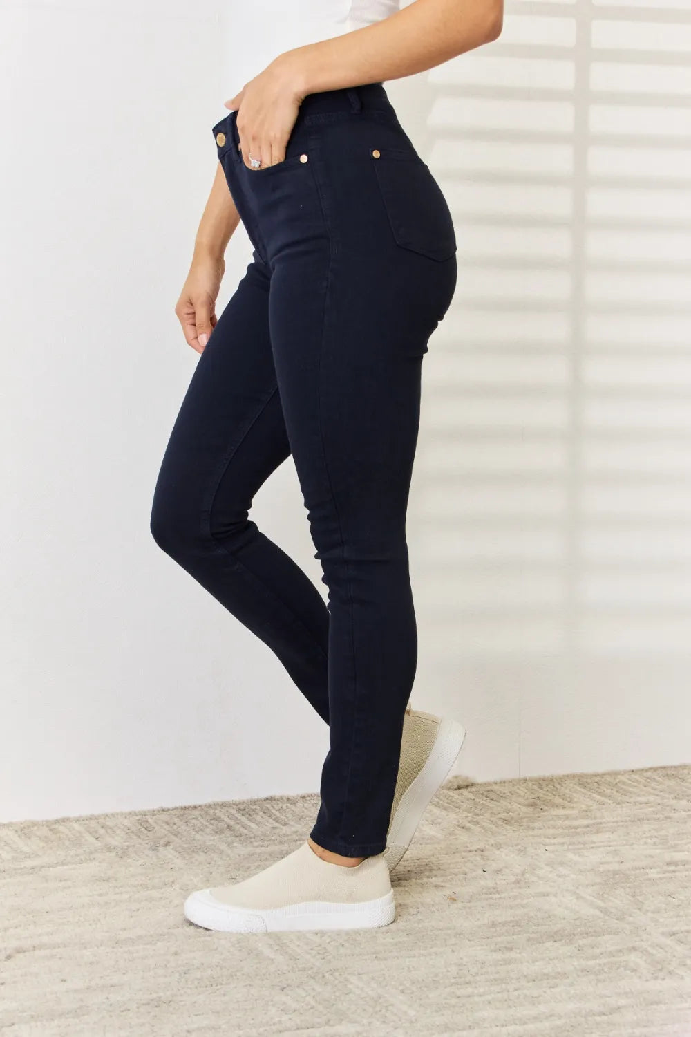 Navy Judy Blue full-size garment-dyed tummy control skinny jeans, shown on a model, showcasing fit and fabric texture.