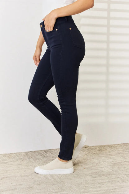 Navy Judy Blue full-size garment-dyed tummy control skinny jeans, shown on a model, showcasing fit and fabric texture.