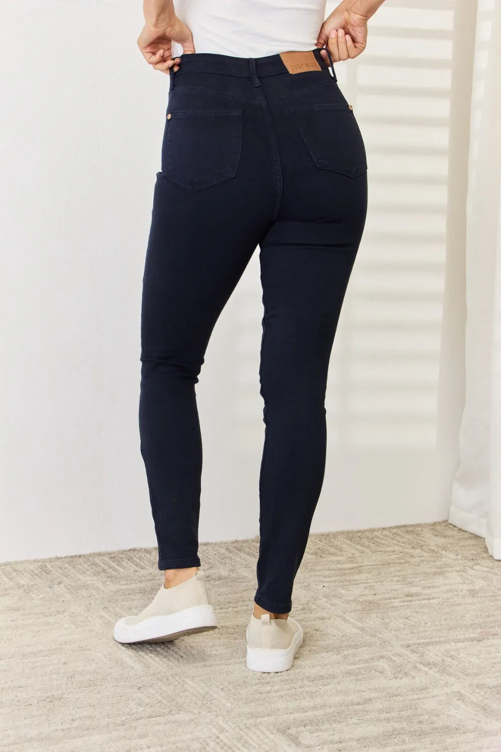 Navy Judy Blue full-size garment-dyed tummy control skinny jeans with a fitted silhouette and classic five-pocket design.