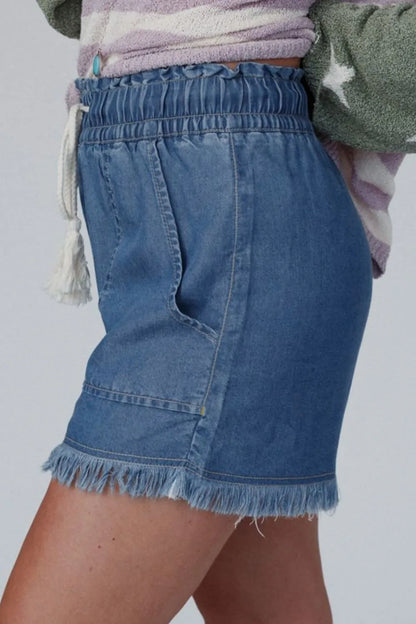 Navy raw hem drawstring high waist denim shorts with pockets, casual style by Trendsi, shown on a model.