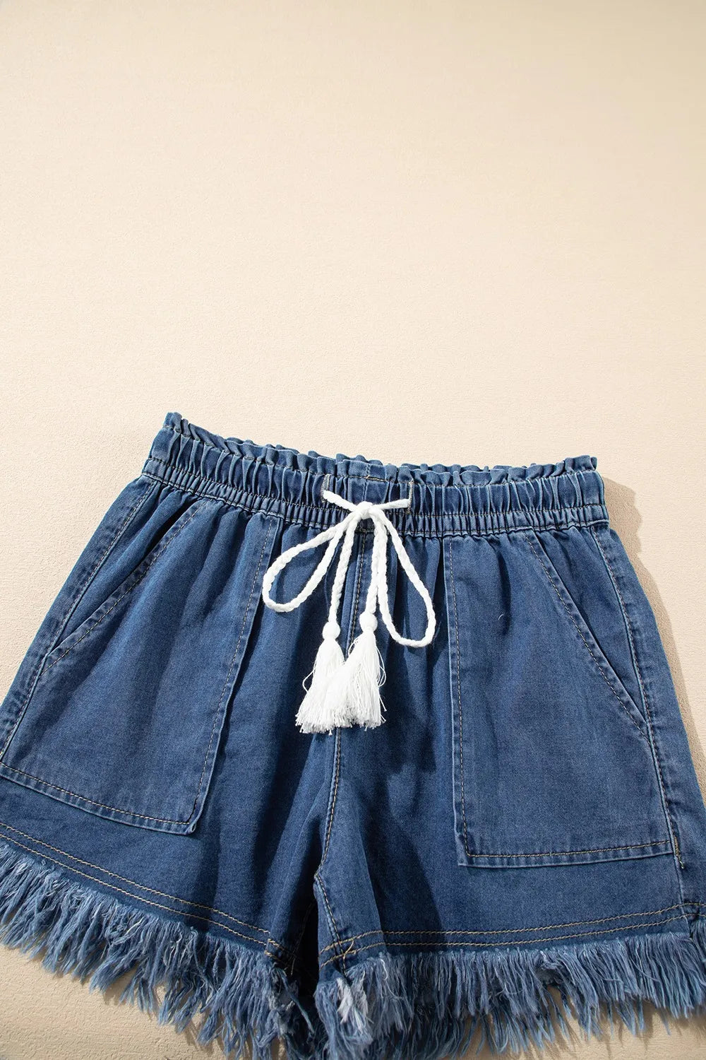 Navy raw hem high waist denim shorts with drawstring waist and front pockets by Trendsi, casual summer style.