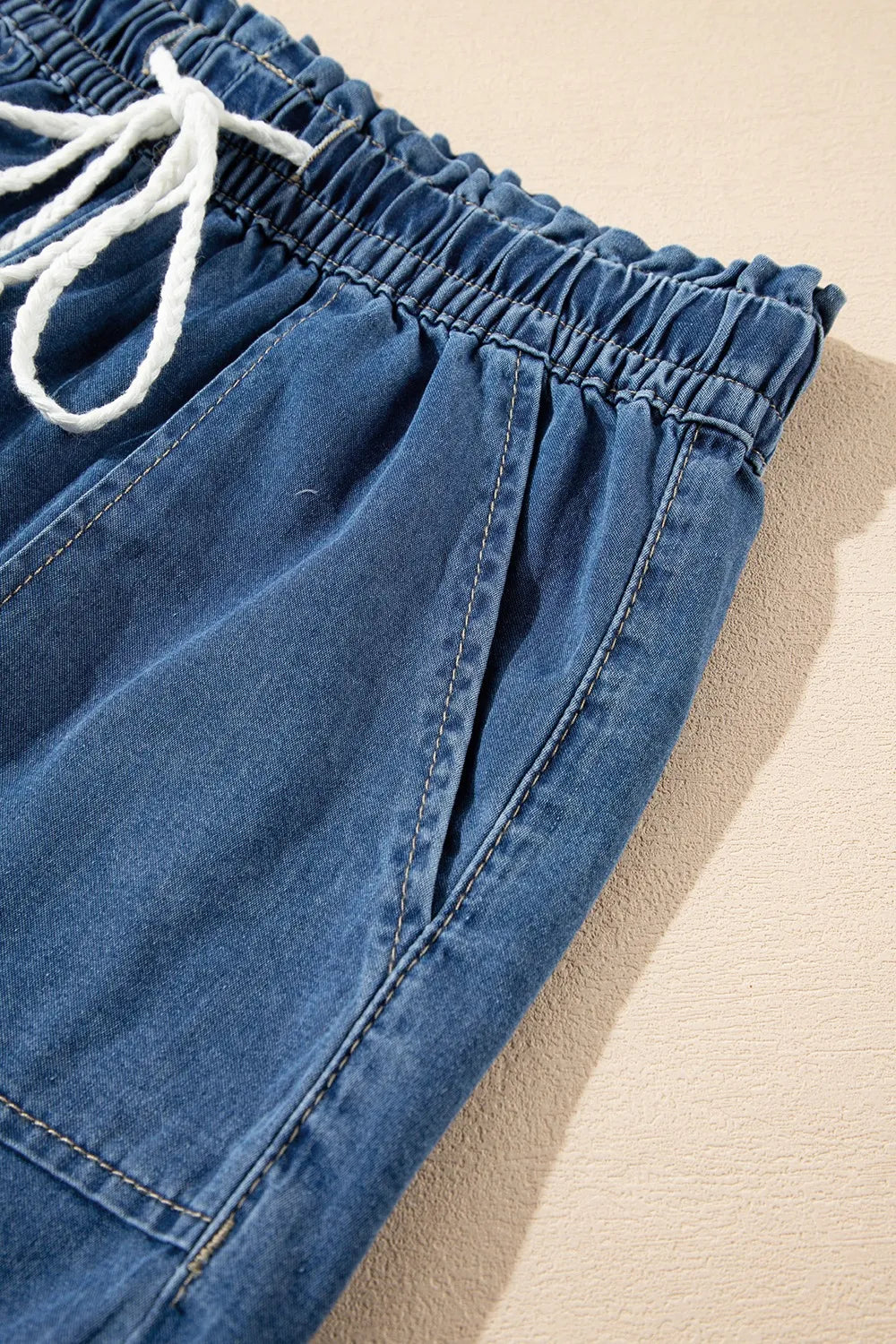 Navy raw hem drawstring high waist denim shorts with front pockets, casual trendy style from Trendsi.