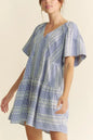 Navy blue Davi & Dani embroidered stripe ruffled gingham mini dress with ruffled sleeves and a fitted waist.