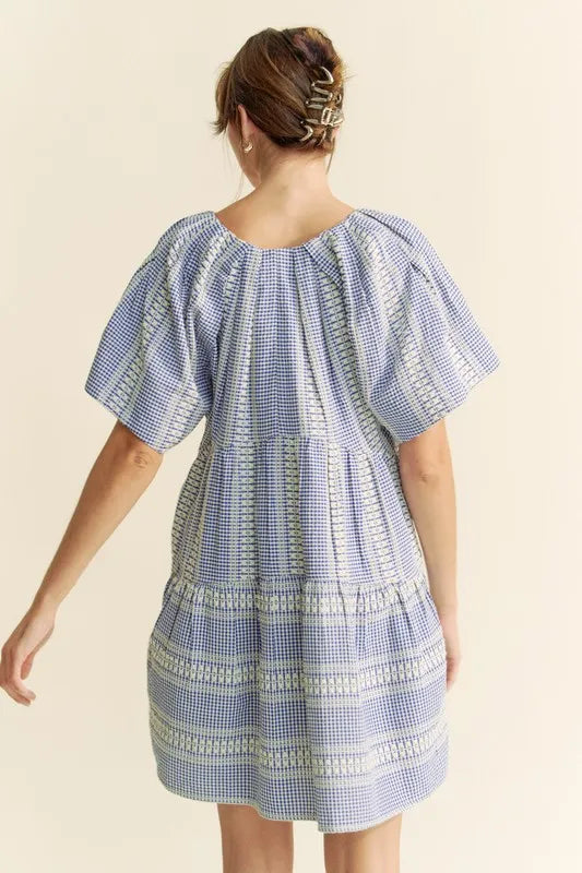 Navy blue Davi & Dani embroidered stripe ruffled gingham mini dress featuring a fitted bodice and flared skirt.