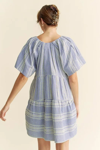 Navy blue Davi & Dani embroidered stripe ruffled gingham mini dress featuring a fitted bodice and flared skirt.