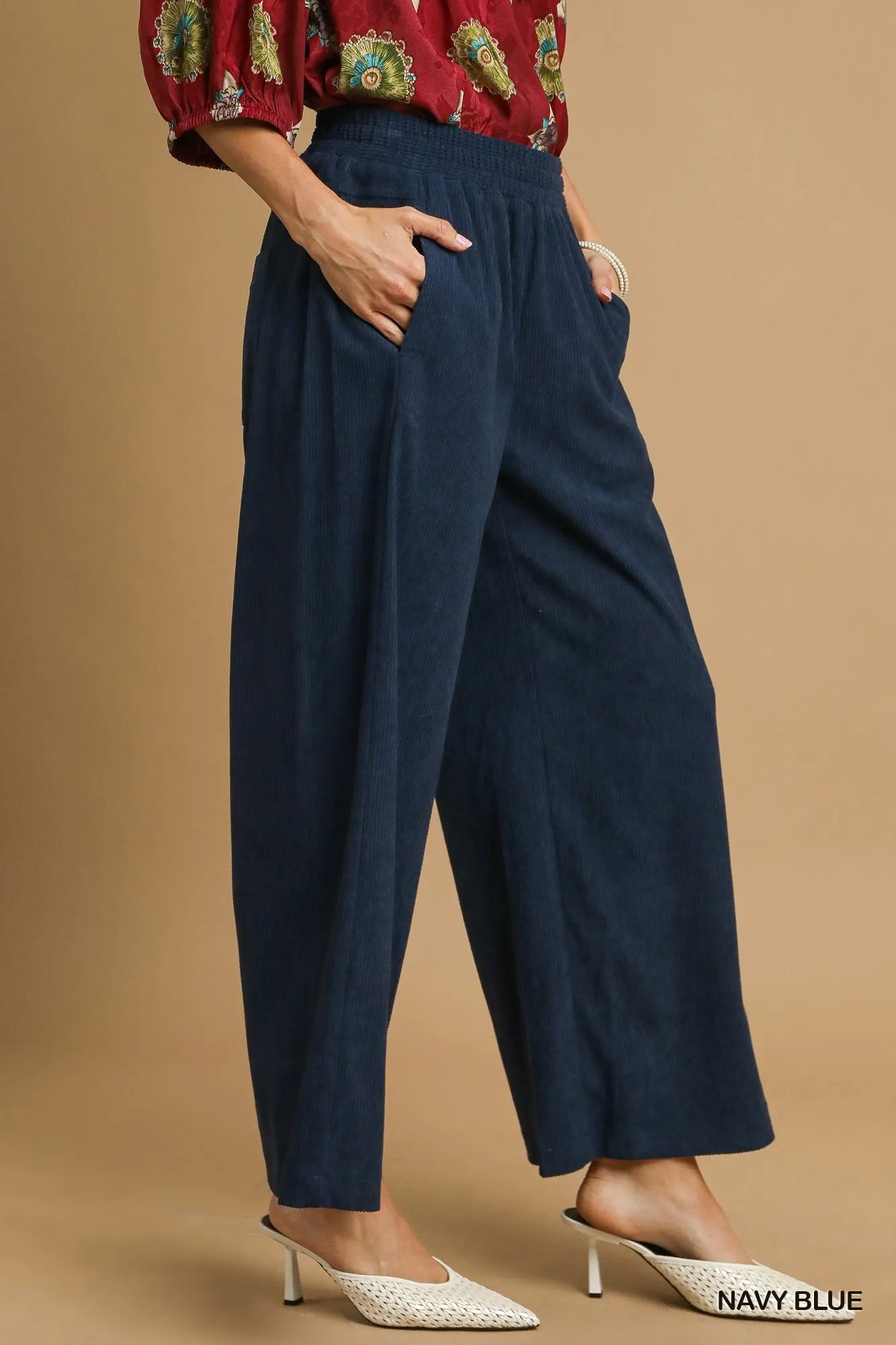 Navy blue Umgee wide-leg corduroy pants with high waist and relaxed fit, styled on a model.