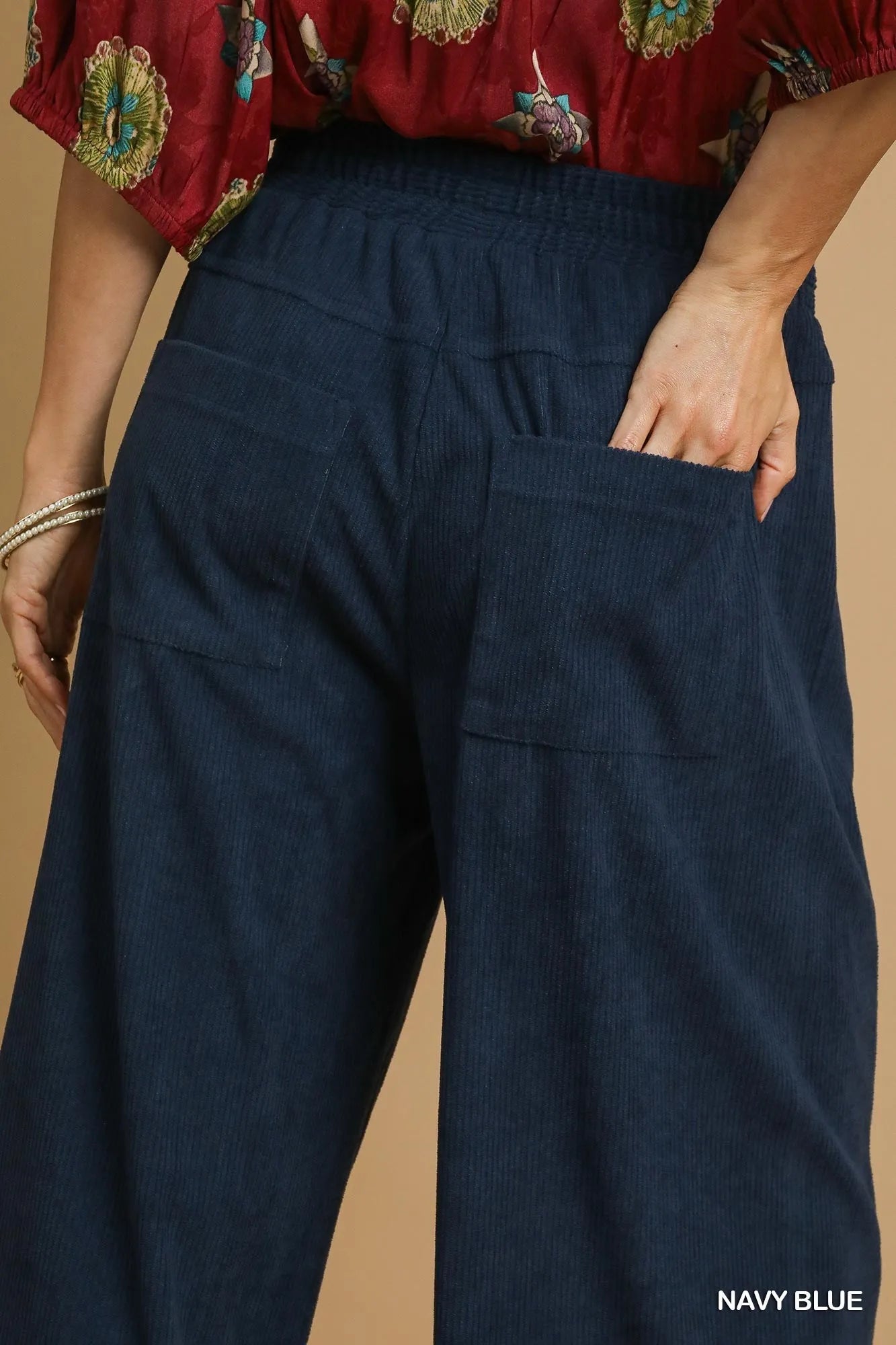 Navy blue Umgee wide-leg corduroy pants from Trendsi, featuring a relaxed fit and textured corduroy fabric.