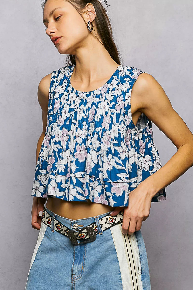 Navy floral round neck cropped pintuck tank top by Trendsi, featuring a floral pattern and pintuck detailing.