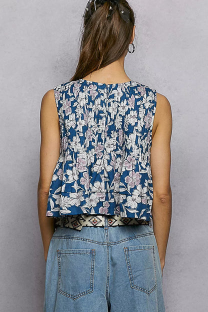 Navy floral round neck cropped tank top with pintuck detailing, from Trendsi, featuring a relaxed fit and lightweight fabric.