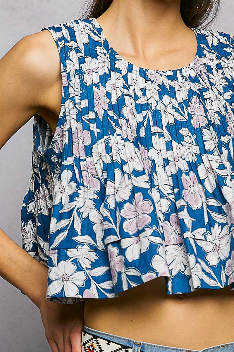 Navy floral round neck cropped tank top with pintuck details, made by Trendsi, displayed on a mannequin.