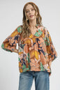 Trendsi Umgee multicolor floral print blouse with ruffle neckline and long sleeves, abstract floral design in navy and bright colors.