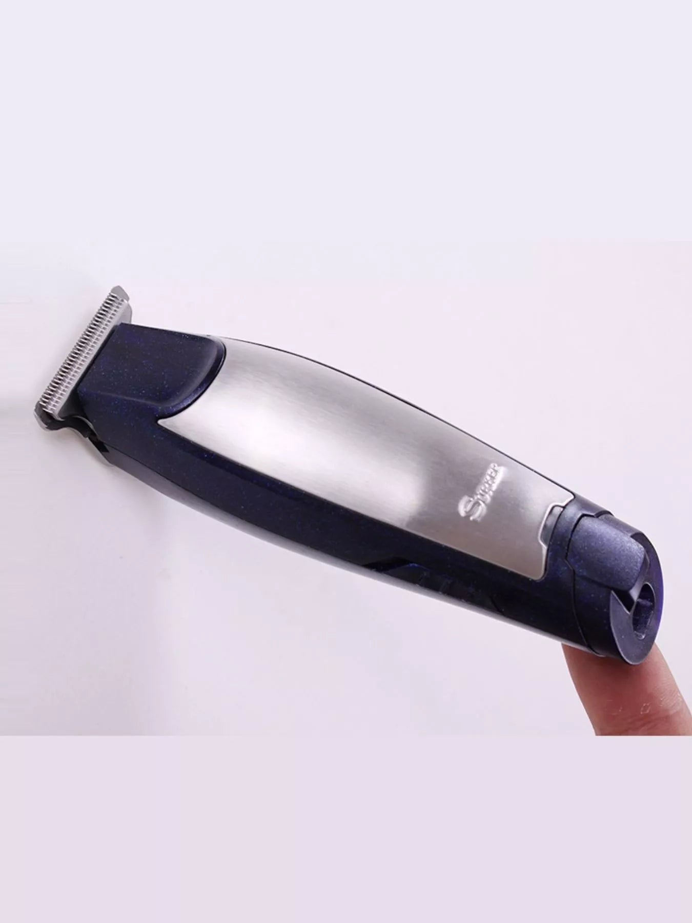 Navy Trendsi Precision Cordless Hair Clipper with ergonomic design and adjustable blades for easy haircutting.