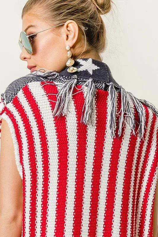 Navy and red BiBi American flag fringe-edged sweater vest by Trendsi, featuring patriotic stars and stripes design.