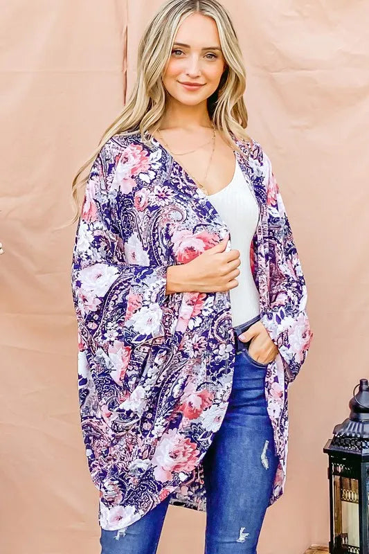 Navy floral print dolman sleeve kimono cardigan by Trendsi, displayed on a hanger with a lightweight, flowy fabric.