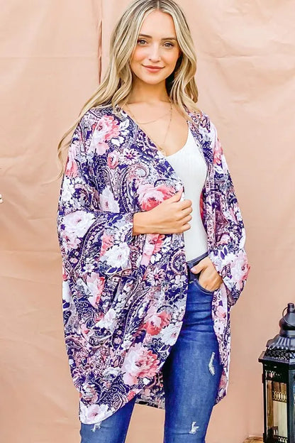 Navy floral print dolman sleeve kimono cardigan by Trendsi, displayed on a hanger with a lightweight, flowy fabric.