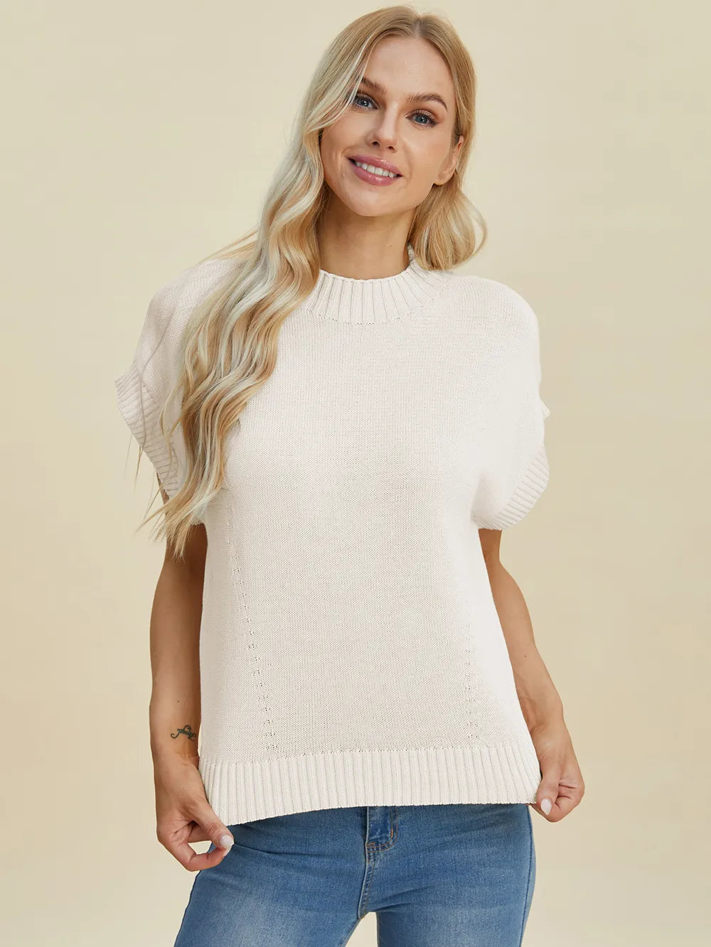 Navy Trendsi Double Take full-size mock neck short sleeve sweater displayed on a hanger, showcasing its fitted design and soft fabric.