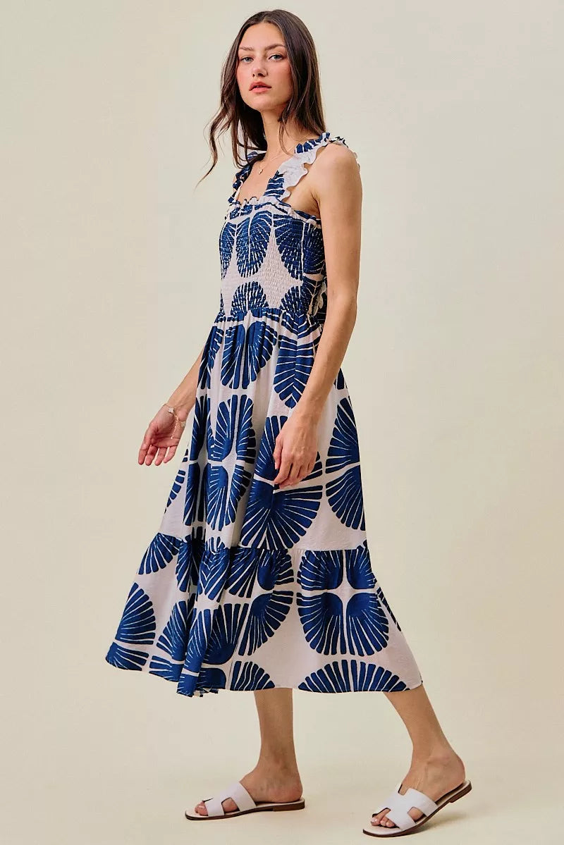 Navy SO ME abstract print midi dress with smocked bodice, tiered design, and lining, styled for casual or semi-formal wear.