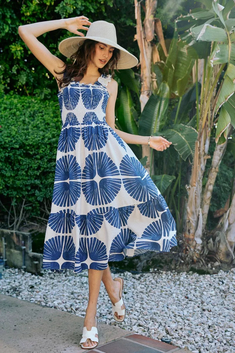 Navy SO ME abstract print midi dress with smocked bodice, tiered design, and lining, featuring a stylish and feminine silhouette.