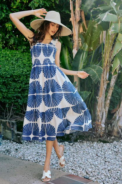 Navy SO ME abstract print midi dress with smocked bodice, tiered design, and lining, featuring a stylish and feminine silhouette.