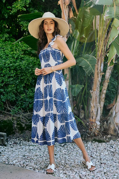 Navy SO ME abstract print midi dress with smocked bodice, tiered design, and lining, featuring a stylish and flowy silhouette.