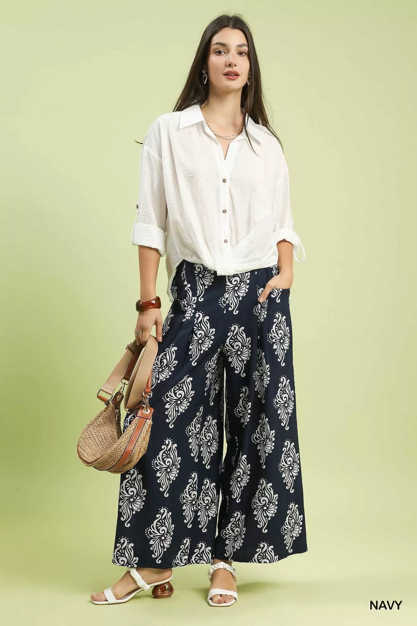 Navy Umgee abstract print wide-leg pants with a relaxed fit and high waist, styled for casual or trendy outfits.