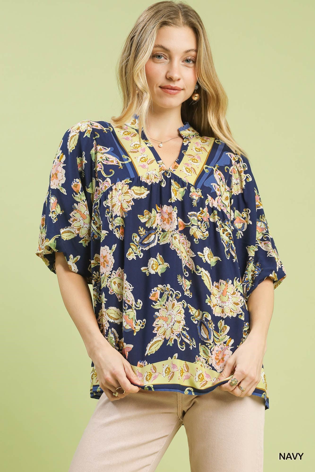 Navy Umgee Apricot Floral Boho Blouse with long sleeves and a relaxed fit, featuring a vibrant floral pattern.