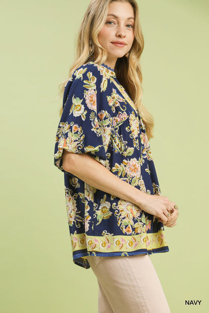 Navy blue Umgee Apricot Floral Boho Blouse with long sleeves and a relaxed fit, featuring a vibrant floral pattern.