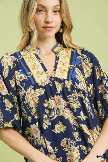 Navy Umgee floral boho blouse with apricot and white flower pattern, long sleeves, and relaxed fit.