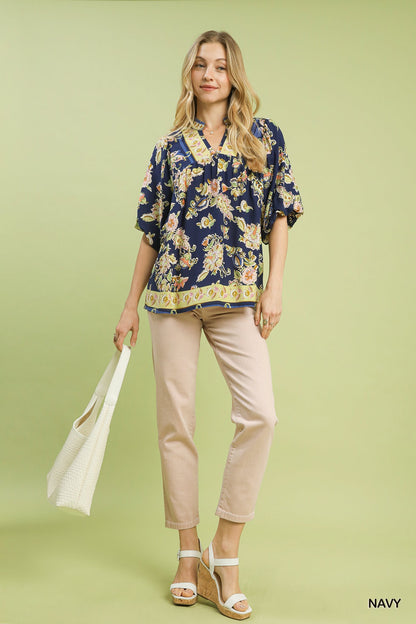 Navy Umgee floral boho blouse with apricot and orange flower print, lightweight fabric, and relaxed fit.