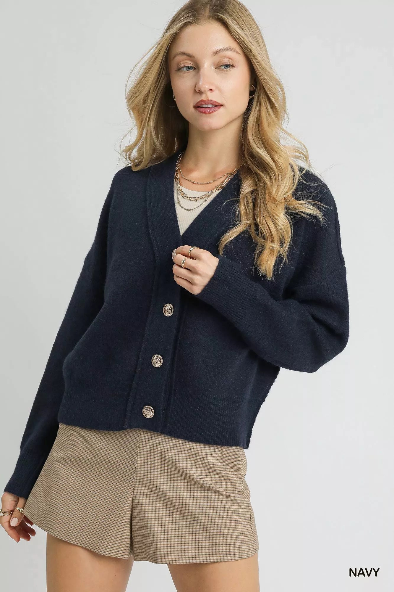 Navy Umgee button-front knit cardigan with long sleeves and ribbed cuffs, casual and cozy style for women.