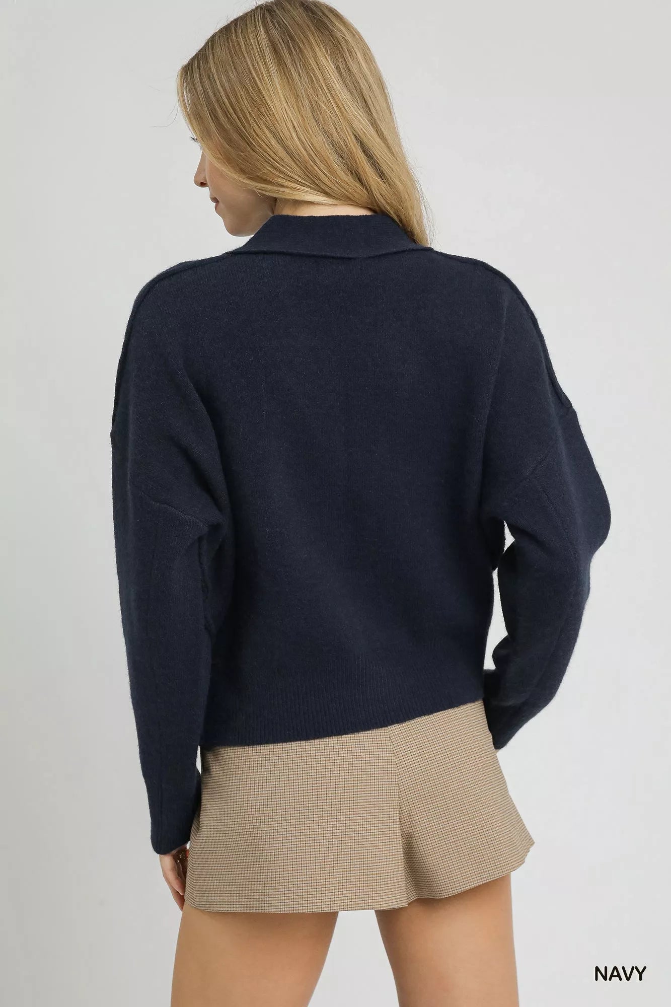 Navy Umgee button-front knit cardigan with long sleeves and ribbed cuffs, styled casually on a model.