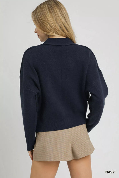 Navy Umgee button-front knit cardigan with long sleeves and ribbed cuffs, styled casually on a model.
