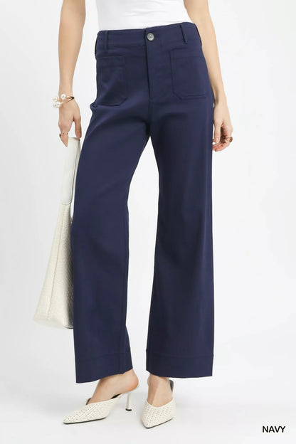 Navy Umgee button-stretched pants by Trendsi, featuring a relaxed fit with button details and comfortable stretch fabric.