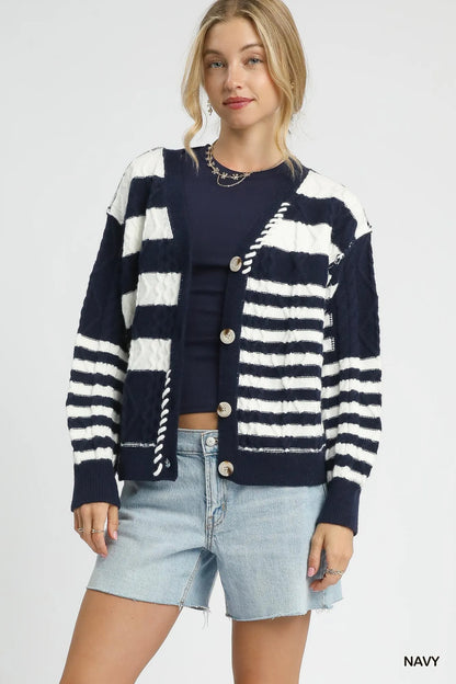 Navy Umgee cable-knit stripe button-up cardigan with front buttons, layered over a casual outfit for a cozy, stylish look.